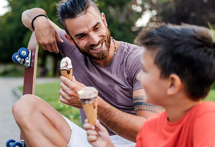 Man and boy eating ice cream