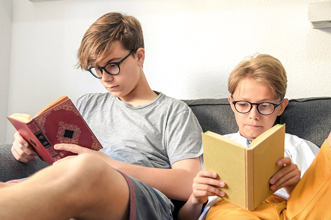 brothers reading about their Child Trust Fund