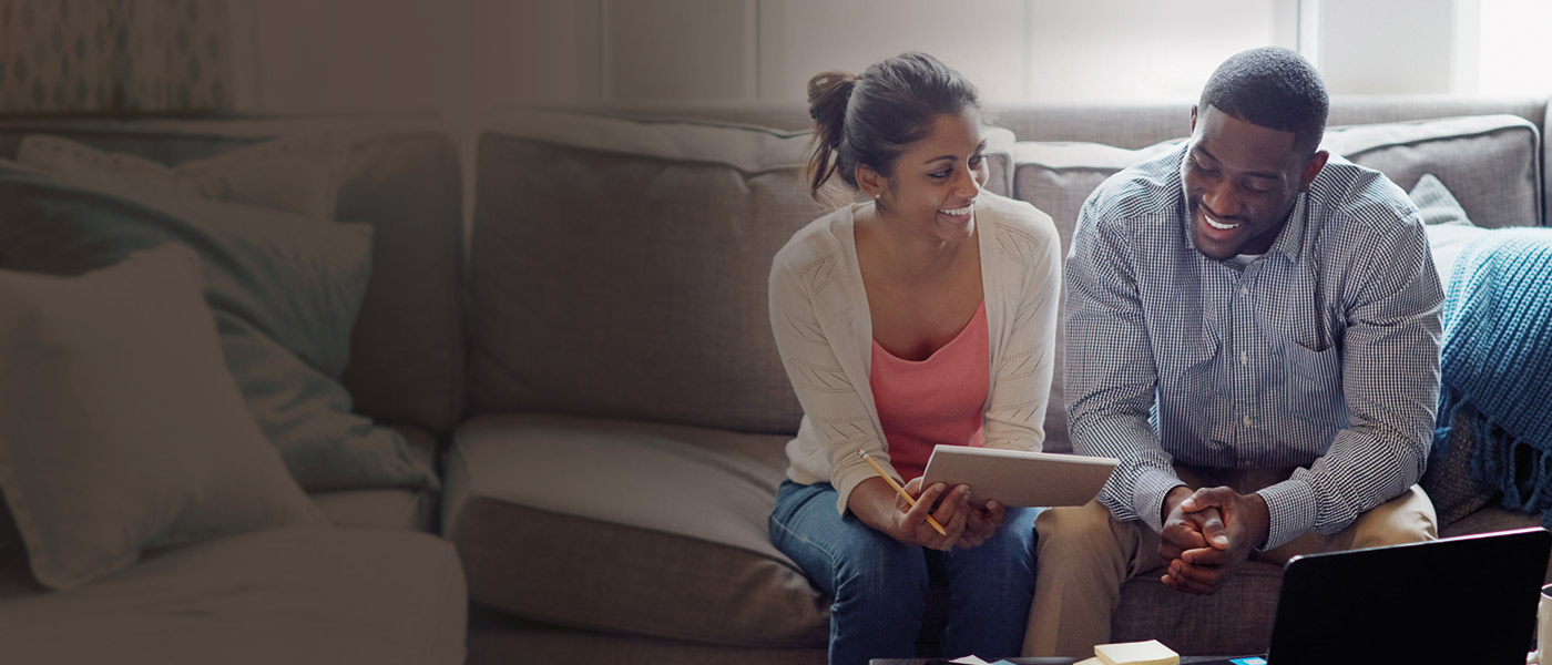 Couple requesting an adviser to discuss mortgage protection
