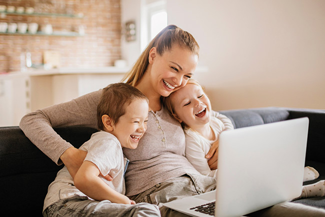 mother with children smiling with insurance cover in place