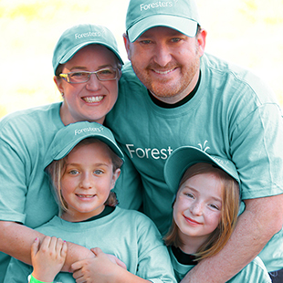 Man, woman and children volunteering