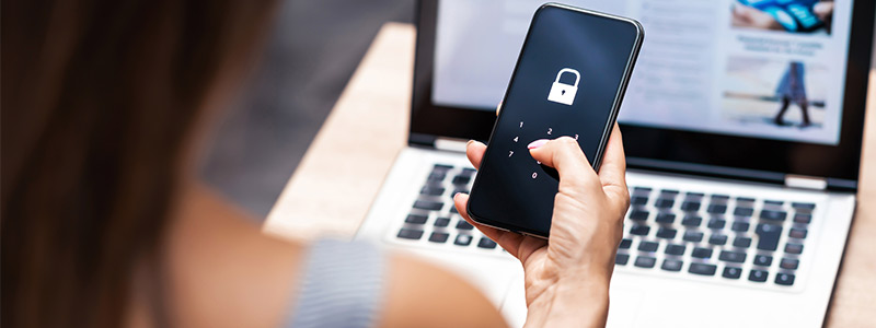 Woman looking at password locked phone