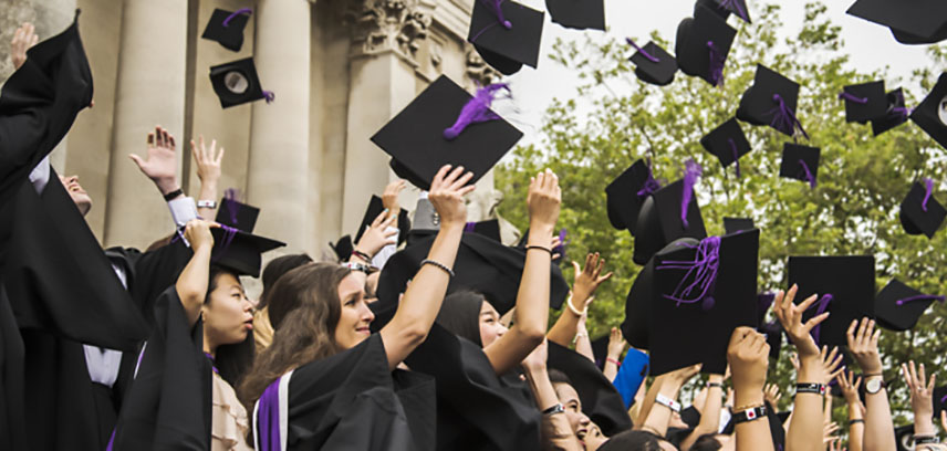 Students graduating throwing mortar boards