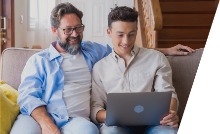 father and son on laptop looking at Foresters ISA