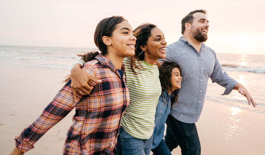 Family walking on beach