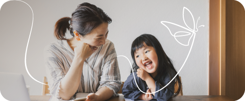 Mother and daughter laughing while mum contributes to daughters Junior ISA for a head start in adult life