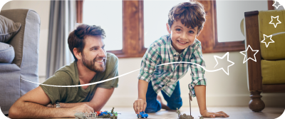 Father and son playing knowing their financial future is sorted with Foresters